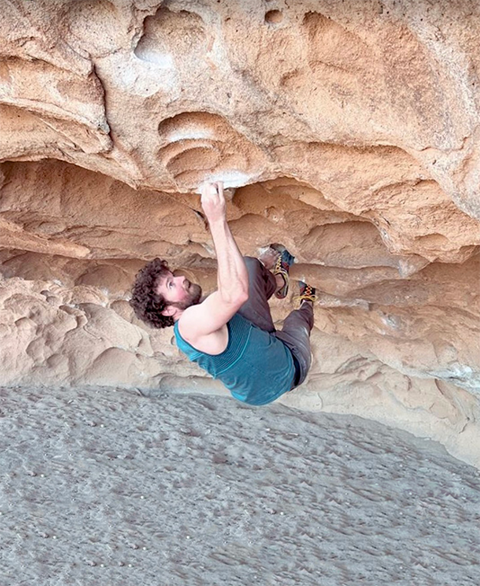 Man climbing boulder. Climber: David Mullins - Photo: Allen Chaney